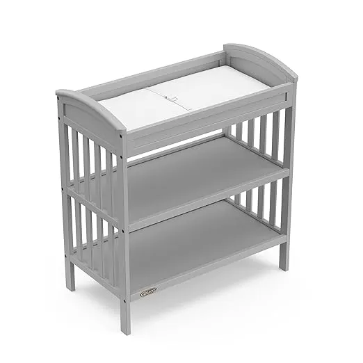 Graco Benton Changing Table with Bonus Water-Resistant Changing Pad (Pebble Gray) - GREENGUARD Gold Certified, Includes Diaper Change Pad with Safety Strap, 2 Open Storage Shelves for Organizing